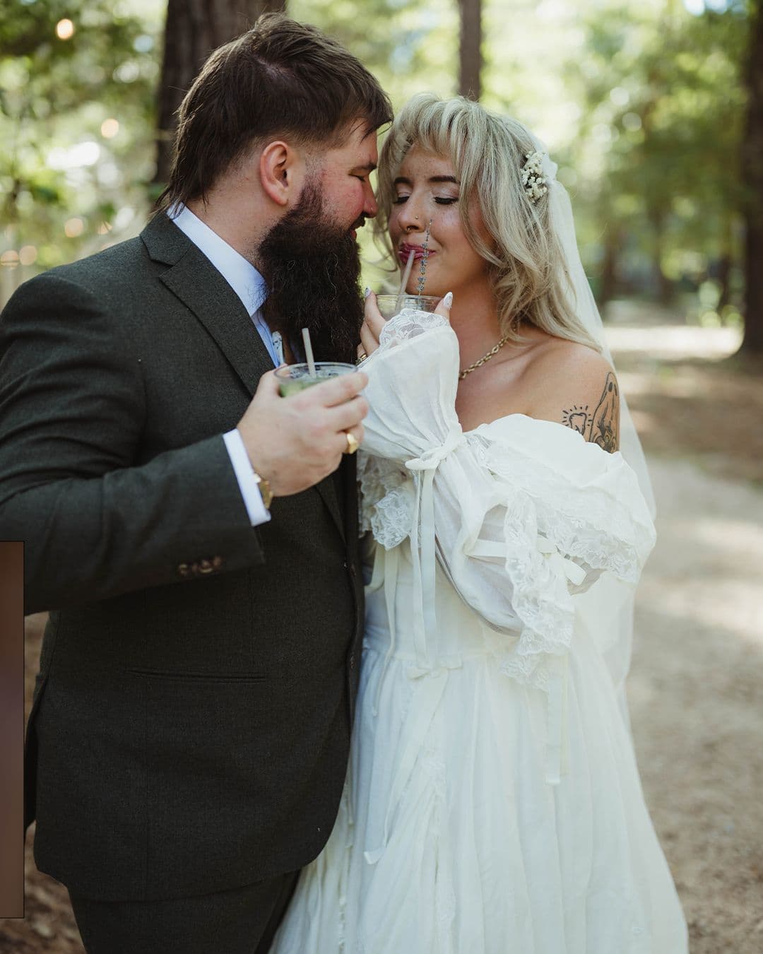 A couple leaning together in soft light on their wedding day