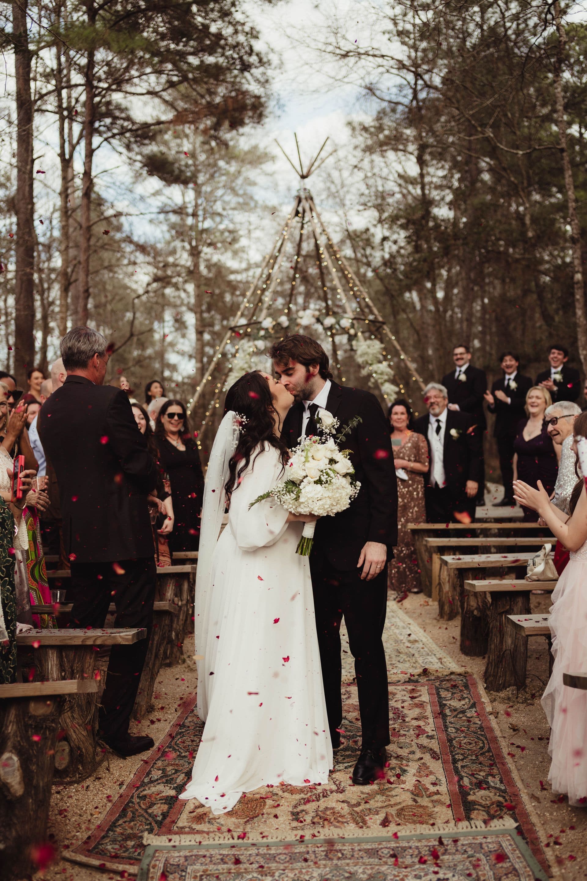 Ben and Katie walking down the aisle at their woodland wedding at the Shire