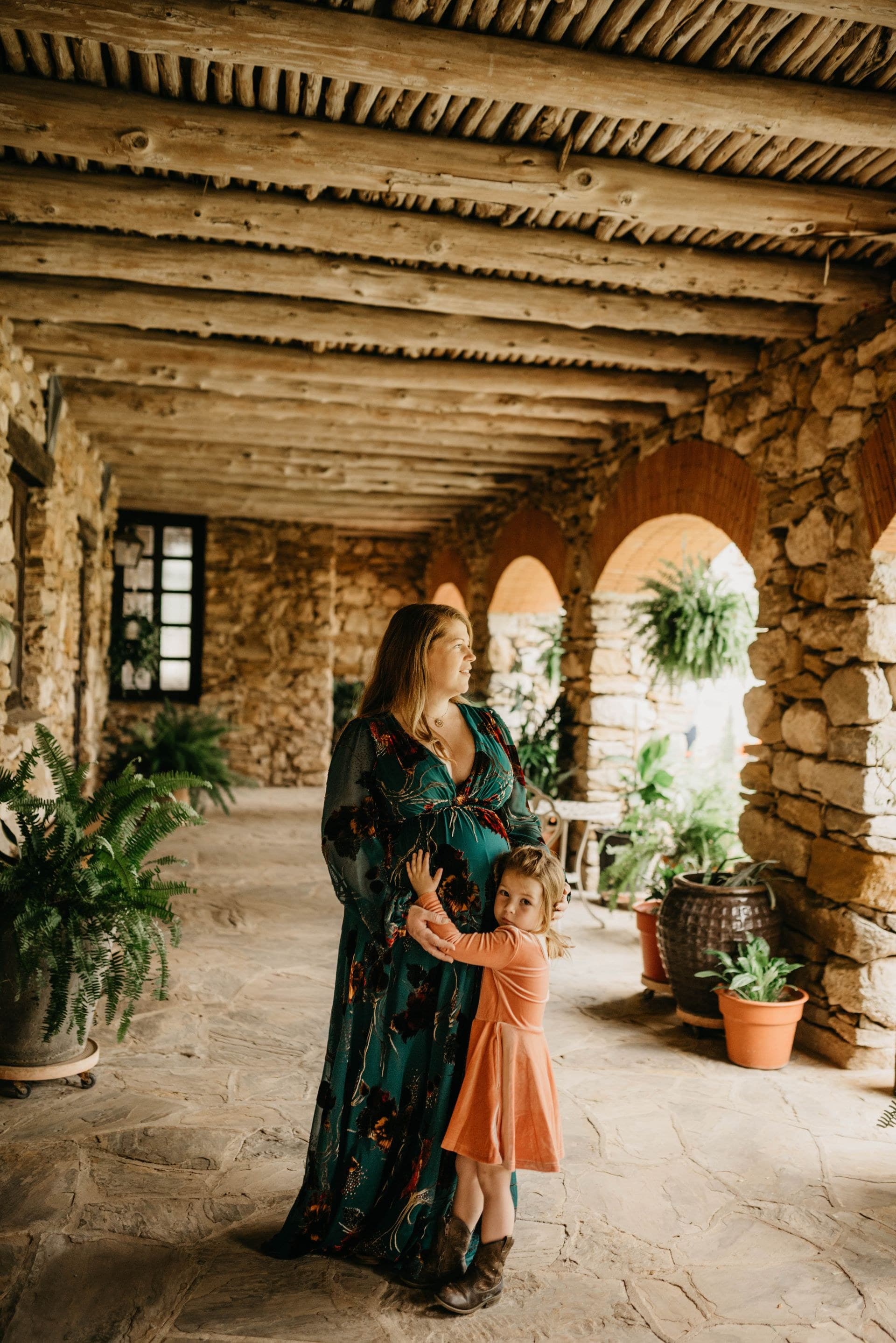 Megan and her daughter together in a shaded mission walkway